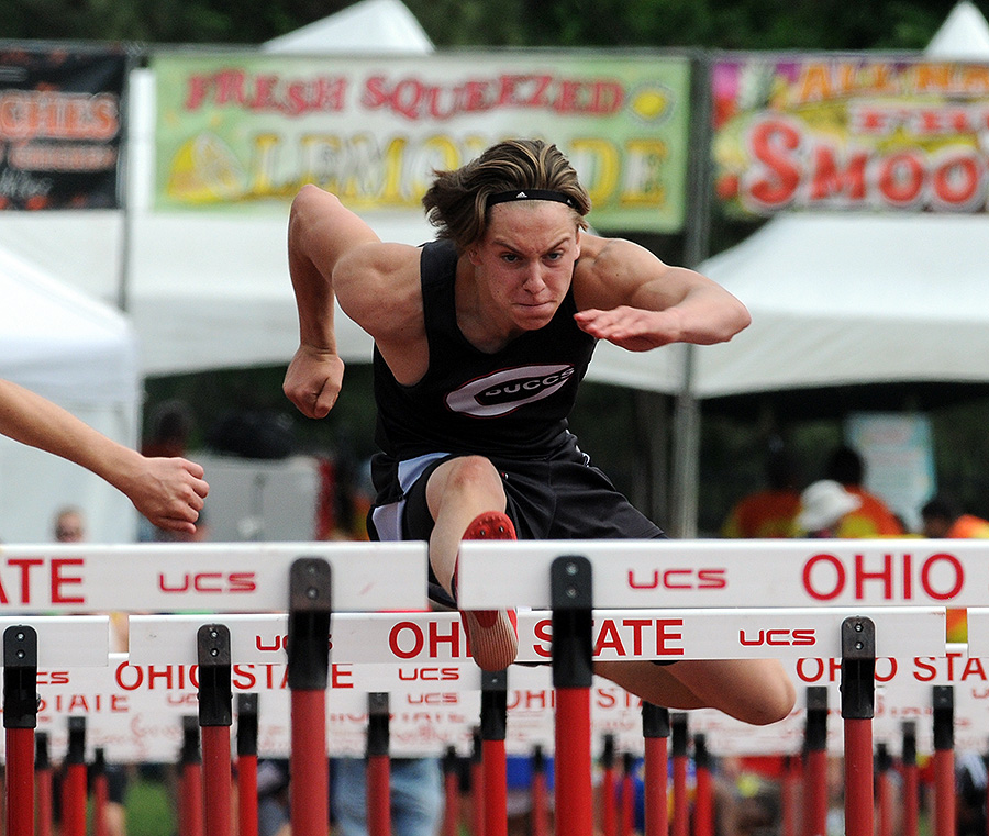 Cade Harshbarger competes in the 110 meter hurdles.